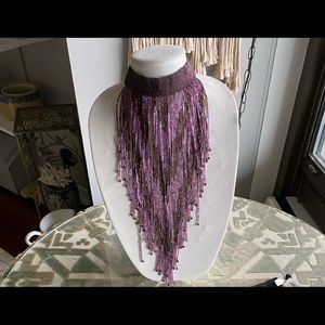 A purple bib necklace cascading 30”